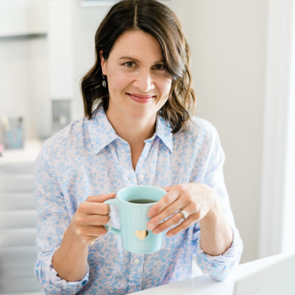 Katie Head shot At desk with tea